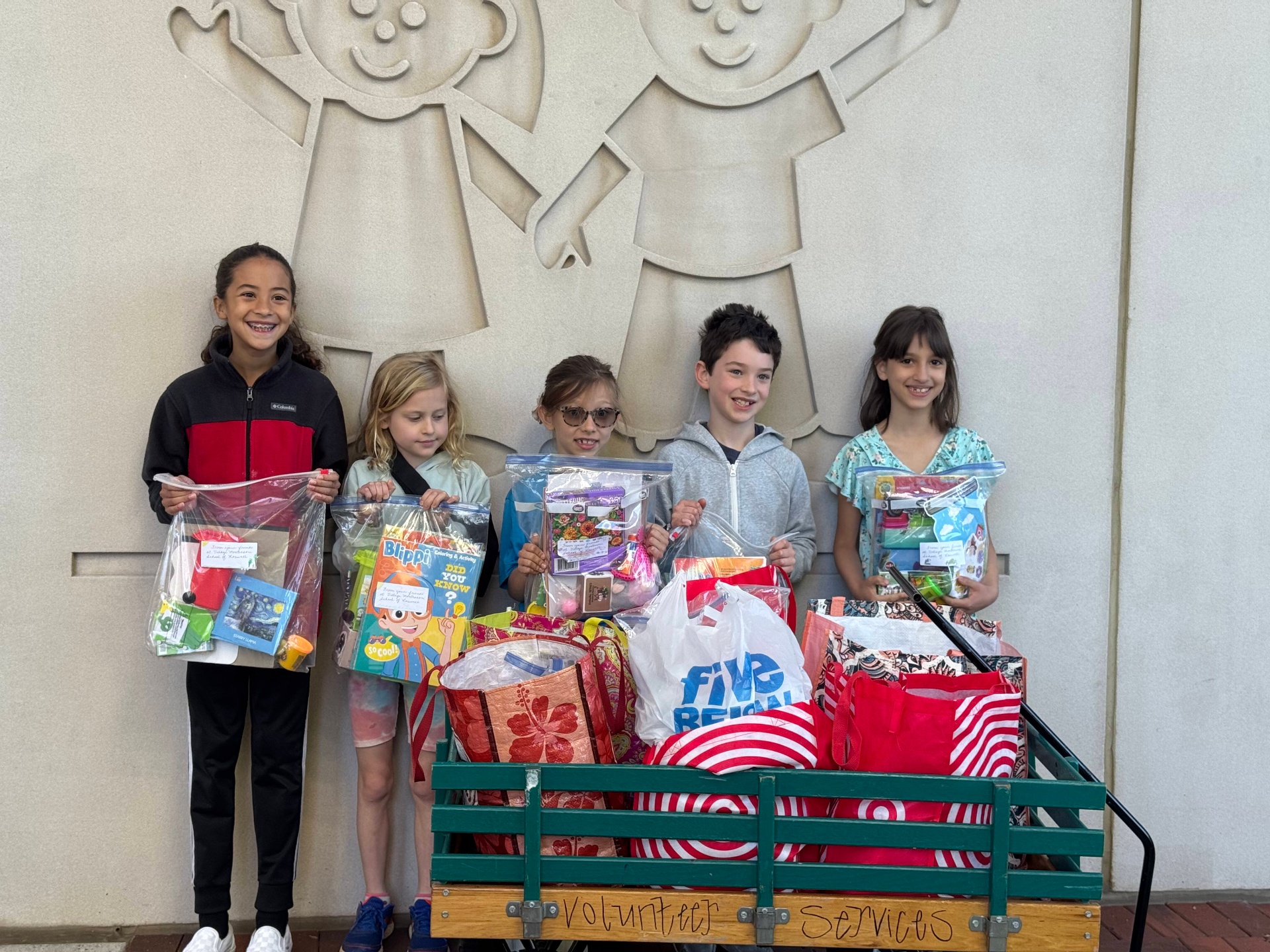 Village Montessori students with community service donations